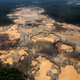 This 2014 photo shows a deforested area dotted with blue tarps, marking the area where miners reside, and craters filled with water, caused by illegal gold mining activities, in La Pampa, in Peru’s Madre de Dios region. Peru’s government declared an emergency across a broad jungle region because of mercury contamination, much of it caused by wildcat gold mining. Photo: AP